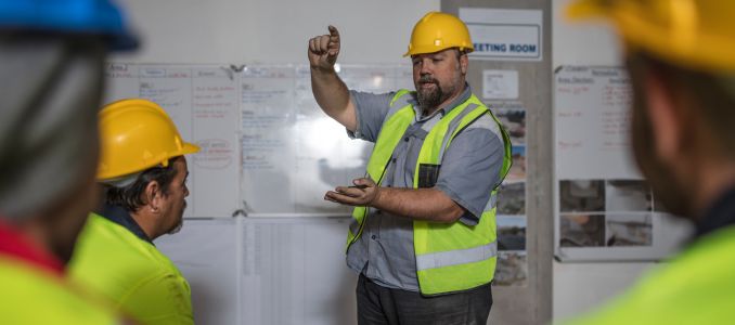 Construction worker leading staff training session