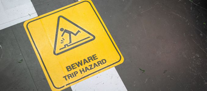 "Beware trip hazard" safety caution symbol on the ground