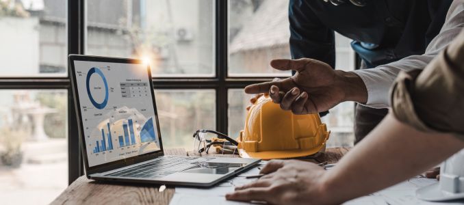 Safety professionals looking at laptop