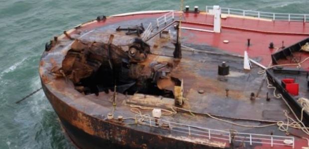 This U.S. Coast Guard photo included in the NTSB report shows damage to the port bow of barge B. No. 255 after the explosion.