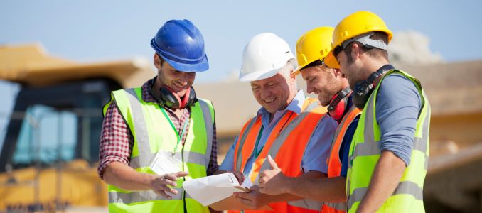 Construction Workers Gathered in a Meeting