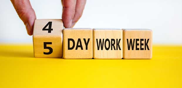 four wooden blocks sit on a yellow surface with a white background. the first block is being flipped from 5 to 4. the rest of the blocks say, in order, "day", "work" and "week"