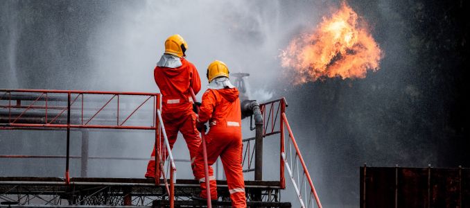 Workers Putting Out a Warehouse Fire