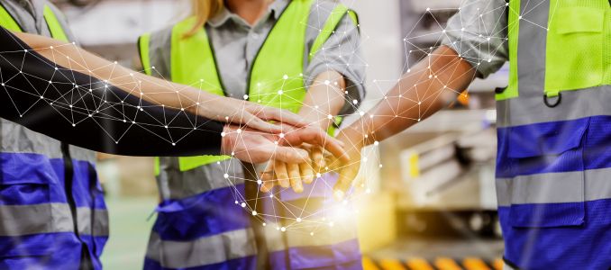 Group of Construction Workers Holding Hands