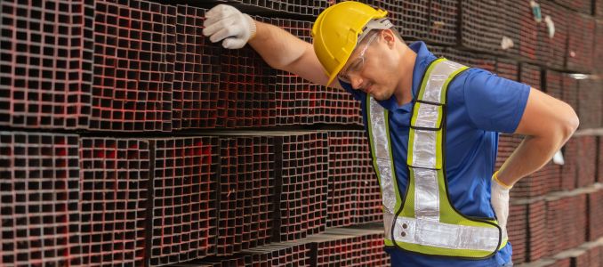 Metal worker with back pain