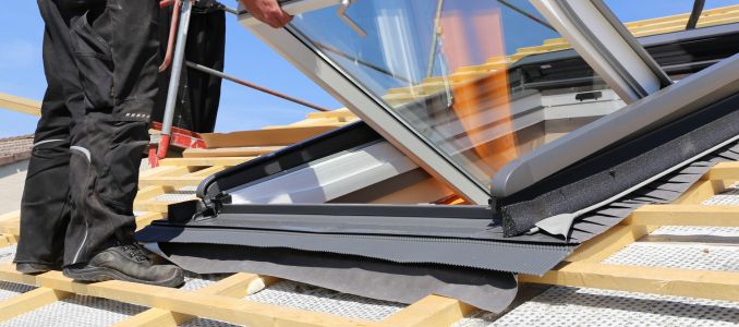 Roofer Installing Skylight