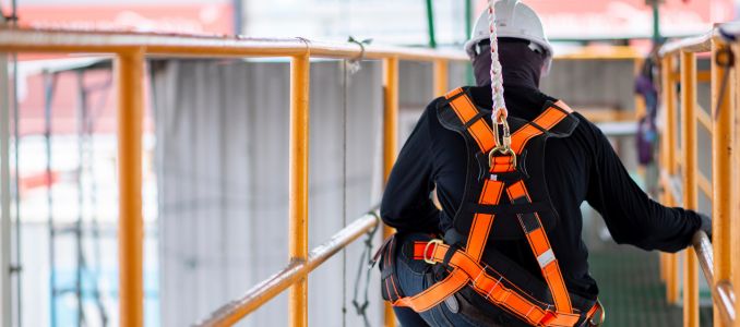 Construction worker wearing a harness