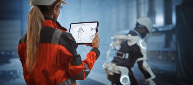 Engineer monitoring exoskeleton vitals