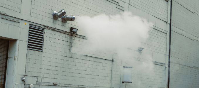 Building dispelling smoke 