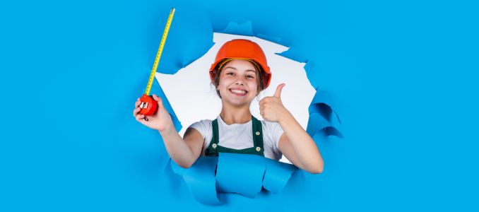 Teen as a construction worker with blue background