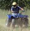 a rider on a four-wheeled all terrain vehicle