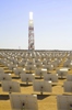 This BrightSource photo show how fields of mirrors focus solar energy on receivers at the top of a tower. Boilers produce steam that turn turbines to create power for the electrical grid.  