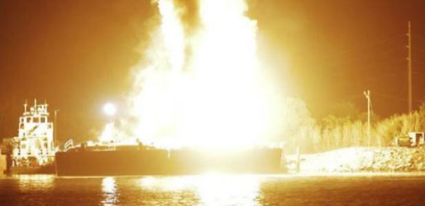 This U.S. Coast Guard photo, showing the fire aboard the two barges on April 24, 2013, is included in the National Transportation Safety Board