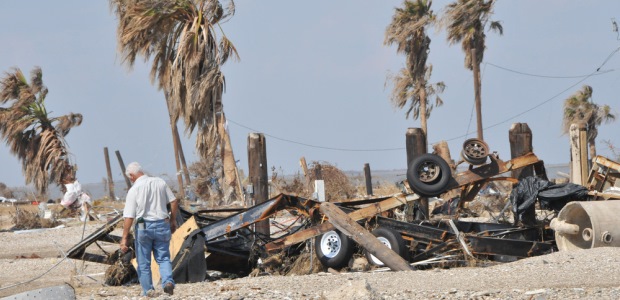 This photo taken by Patsy Lynch on Sept. 24, 2008, shows a resident of Gilchrist Island, Texas, looking at the remains of his home after Hurricane Ike devastated the area. Photo by Patsy Lynch/FEMA.