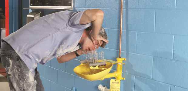 If highly corrosive chemicals are used, the drench shower or eyewash should be placed immediately adjacent to the hazard. (Bradley Corp. photo)