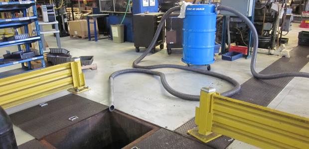 An industrial vacuum is ready to vacuum swarf from a pit. (Vac-U-Max photo)