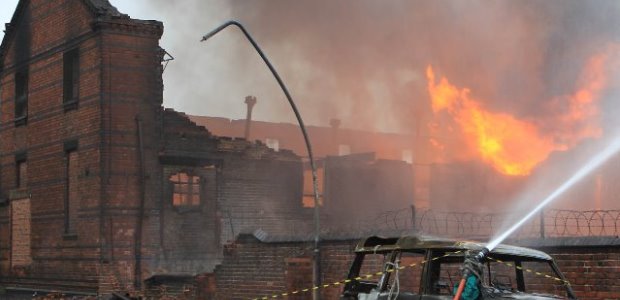 A British distillery was fined about $353,000 on Aug. 18 in a case prosecuted after one of its employees was engulfed in flames during a fire that destroyed an Alcohols Ltd warehouse and its contents. (John McNaughton/West Midlands Fire Service photo)