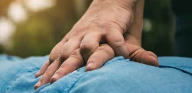 A physical therapist was practicing yoga nearby. She ran over to see what was happening, and quickly began administering CPR.