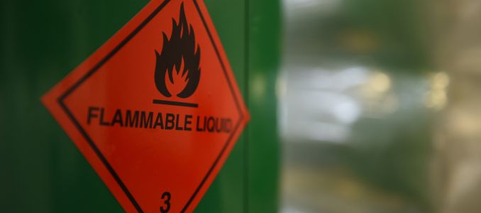 Flammable liquid warning sticker on container