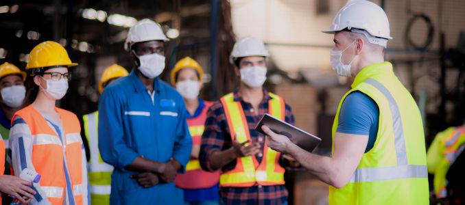 Workers having a safety meeting
