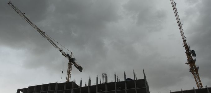 Storm clouds rolling over construction site