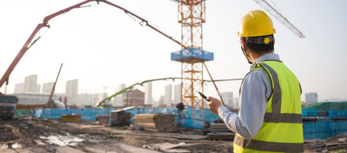 Construction worker looking at construction site