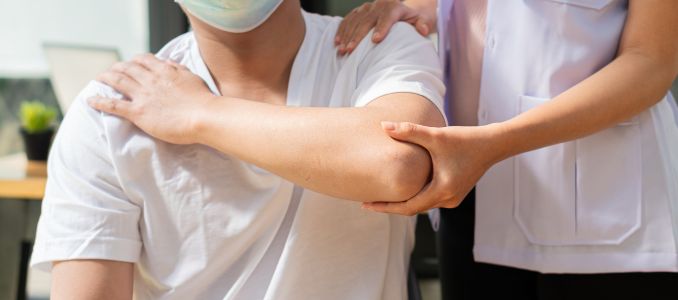 Nurse stretching Patients with musculoskeletal pain in the forearm