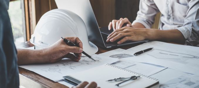 engineer working drawing on blueprint meeting for project