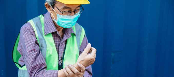elder engineer staff worker wrist pain health problem from hard work