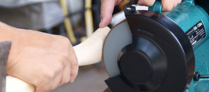 Woodworking the handle of the ax