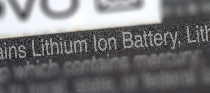 Macro close-up view of text on a label reading "Lithium Ion Battery".