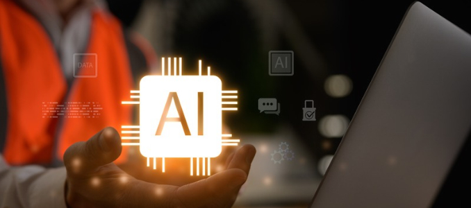 A hand holding a glowing AI microchip icon alongside a laptop, with a worker in a safety vest in the background.