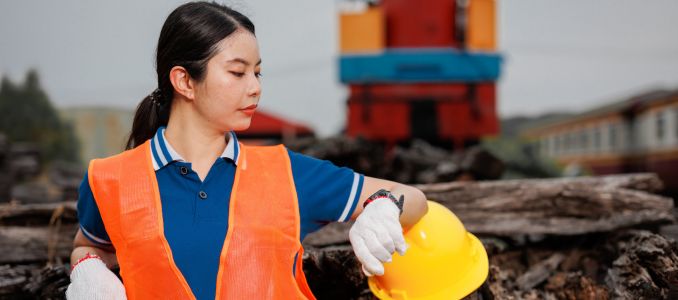 Railway worker checking watch