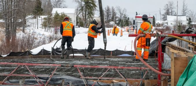 Workers in high-vis vests.