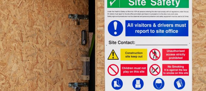 Construction site health and safety sign at entrance
