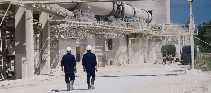 Workers walking across lime plant