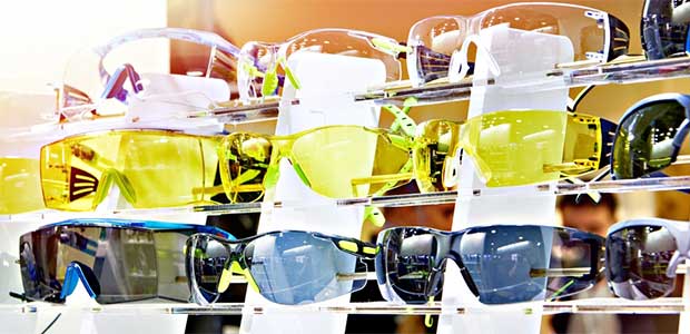three rows of safety glasses, the first all white, the second yellow and the third black