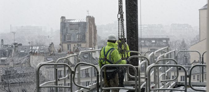 Workers on Scaffolding in Snow