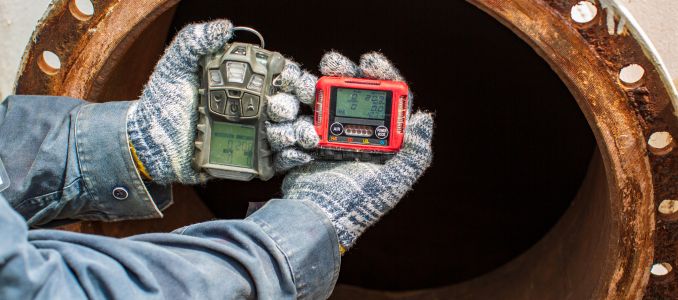 Worker conducting gas detection test