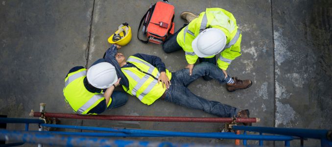 Workers Helping a Sick Co-Worker