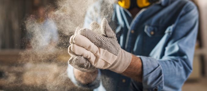 Worker Wearing Dusty Gloves