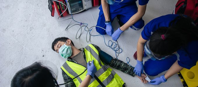 Workers Using an AED Defibrallator