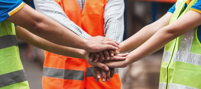 Workers doing a huddle