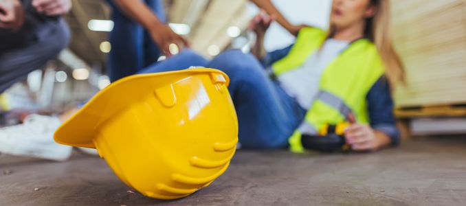 Safety helmet with worker that slipped in background