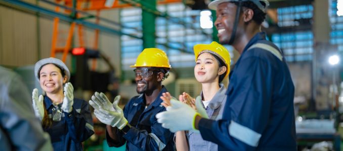 Factory workers giving a round of applause