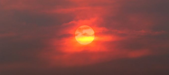 sun through smoke from wildfire