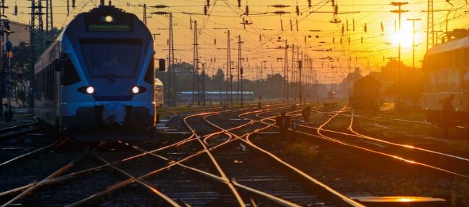 Passenger train on intersecting railway tracks.